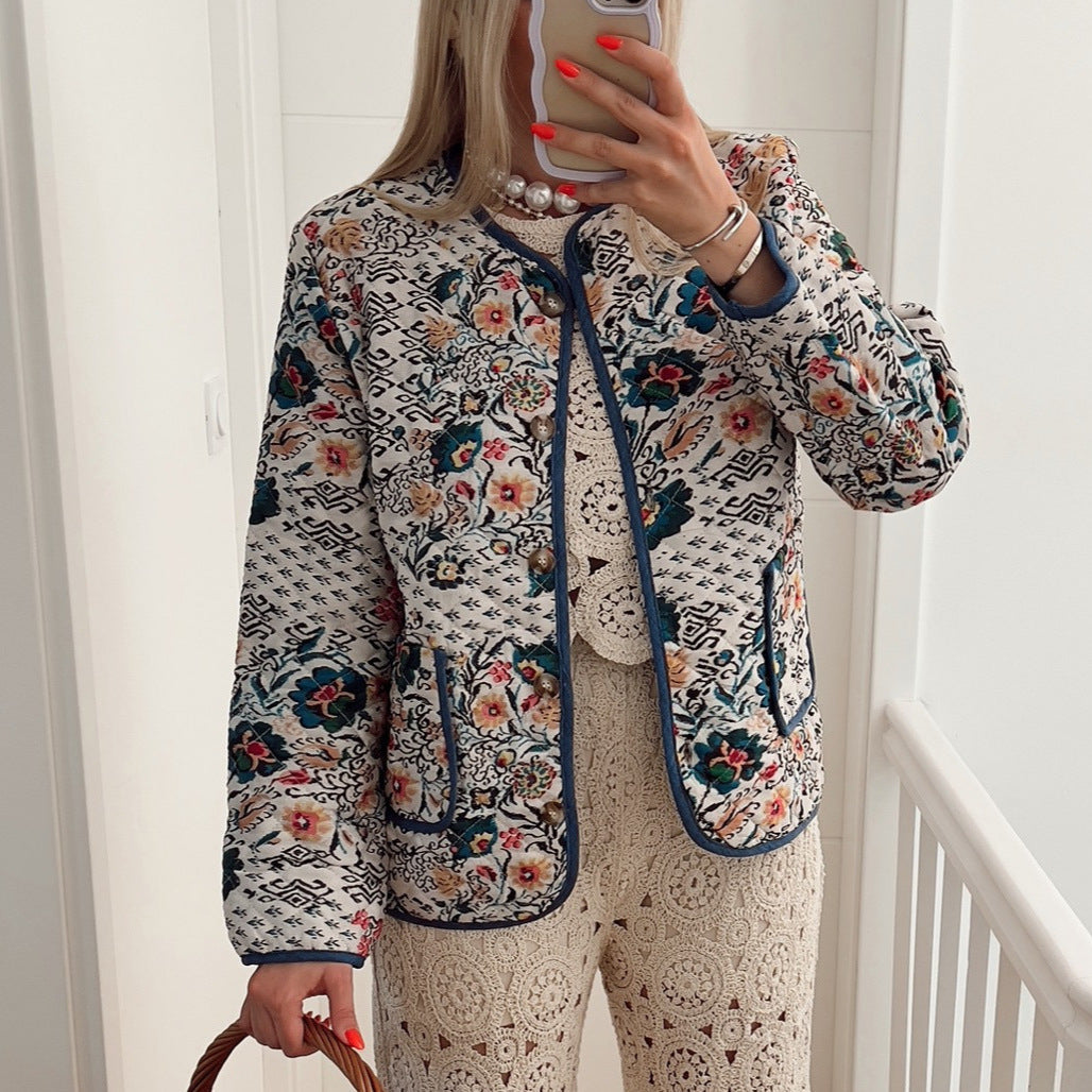 Women's zip-front long-sleeve jacket with round neck, floral patterned, blue-trim pockets