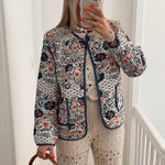 Women's zip-front long-sleeve jacket with round neck, floral patterned, blue-trim pockets