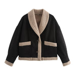 Black short button jacket with beige sherpa lining, chest pockets, and cuff trim