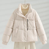 Cream short quilted jacket with stand collar, front zipper, and two flap pockets
