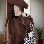 Women’s dark brown zip-up hoodie with hood, kangaroo pocket, and ribbed cuffs