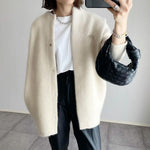 Cream button-front knit cardigan with long sleeves and side pockets