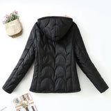Women's black quilted hooded jacket with beige sherpa lining, back view