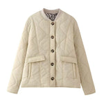 Quilted button-front jacket with pockets and round neckline, cream