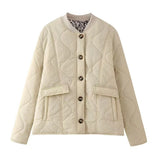 Quilted button-front jacket with pockets and round neckline, cream