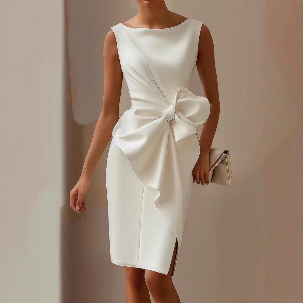 White satin sleeveless dress with draped waist and oversized bow
