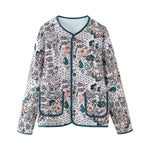 Women's floral patterned zip-front jacket with round neck, blue piping, and side patch pockets