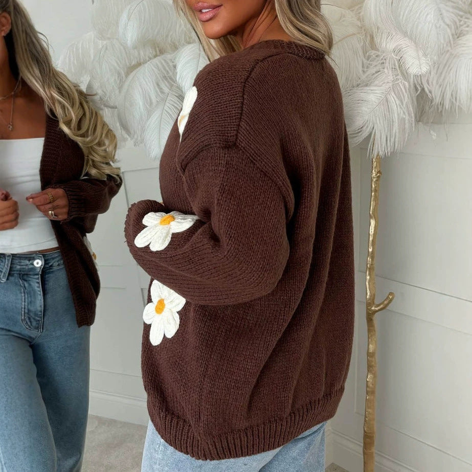 Brown oversized long-sleeve cardigan with white daisy appliqués on the sleeve