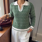 Green V-neck sweater with textured knit pattern and white ribbed collar and cuffs.