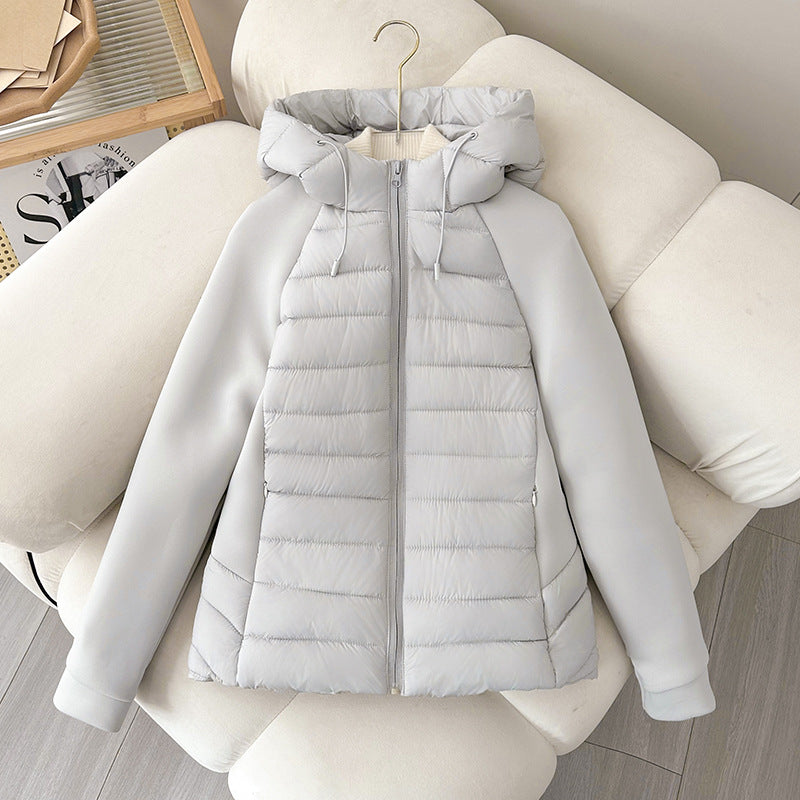 Women’s light hybrid quilted jacket with hood, light gray-white, zip-up on chair