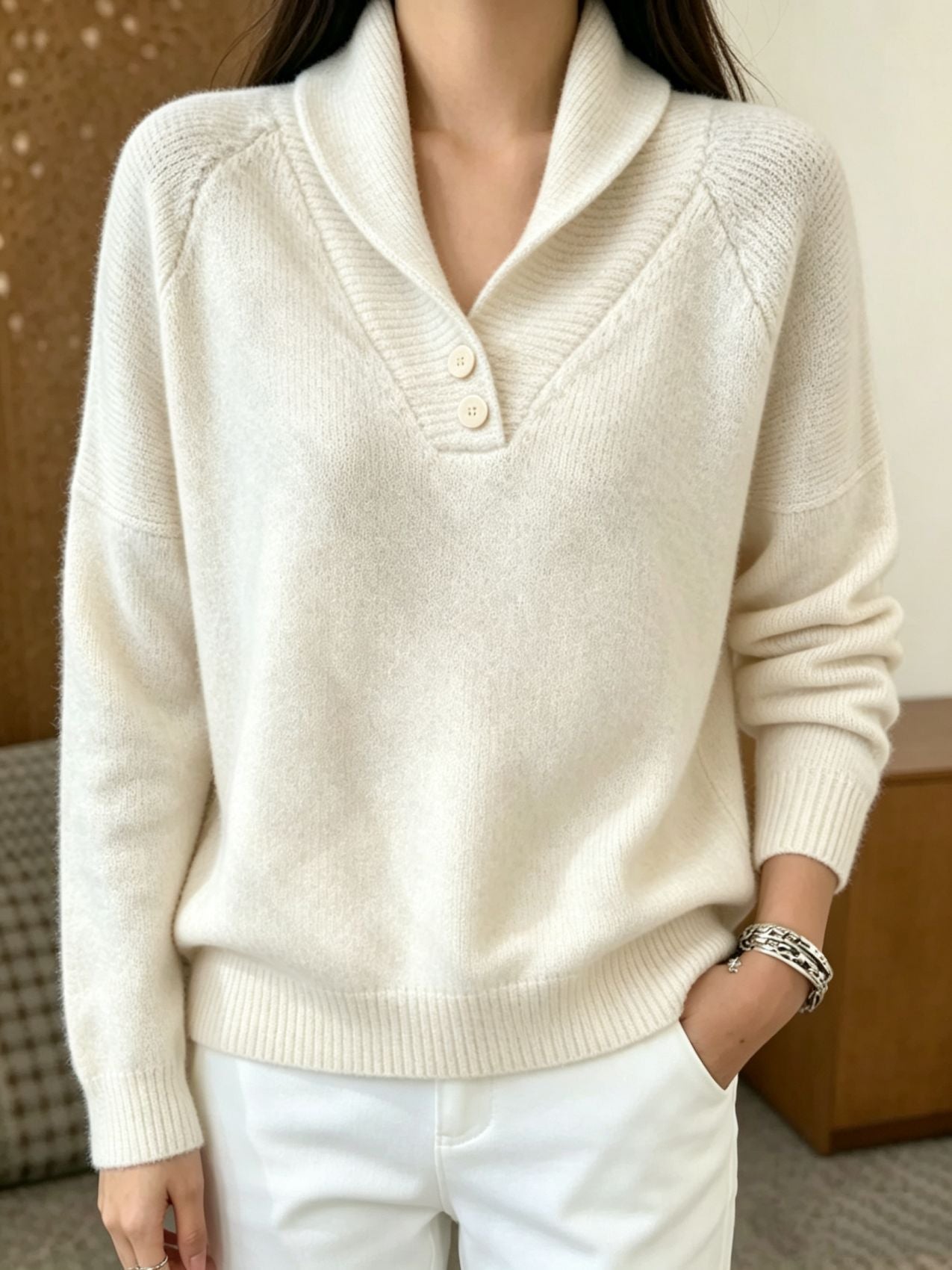 Women’s cream button-front V-neck long-sleeve sweater with ribbed collar and cuffs.