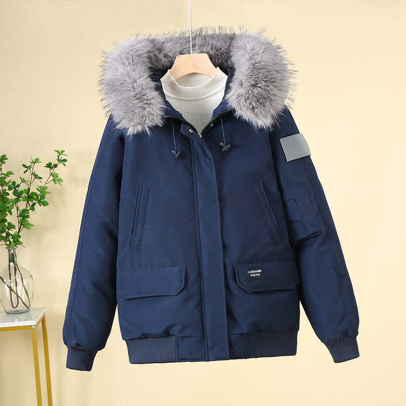 Navy padded bomber jacket with faux-fur hood, zip-front, and ribbed cuffs