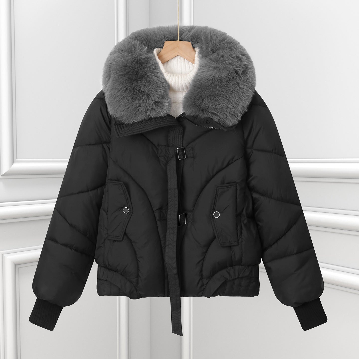 Black short puffer pilot jacket with oversized faux fur collar and drawstring hem.
