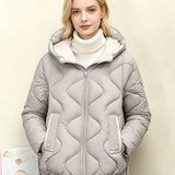 Light gray quilted short jacket with hood, heart stitching, front zipper and side pocket openings.