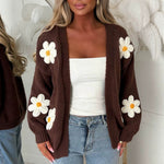Women’s oversized brown long-sleeve cardigan with white daisy appliqués