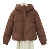 Women’s short quilted hooded jacket in brown, full front view, hidden zipper and chest pocket