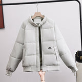 Women’s short quilted bomber jacket, light gray, full-zip with high stand collar and side pockets