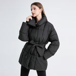 Women's tailored quilted puffer coat in black with tie belt and high shawl collar