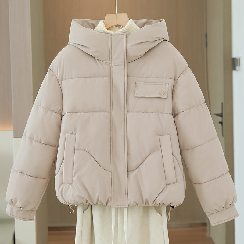 Women’s short quilted hooded jacket in light beige with hidden front zipper and chest pocket