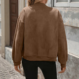 Oversized brown bomber jacket back view with long sleeves and ribbed cuffs