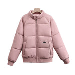 Women’s short quilted bomber jacket, pink, full-zip with high stand collar, chest logo patch