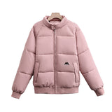 Women’s short quilted bomber jacket, pink, full-zip with high stand collar, chest logo patch