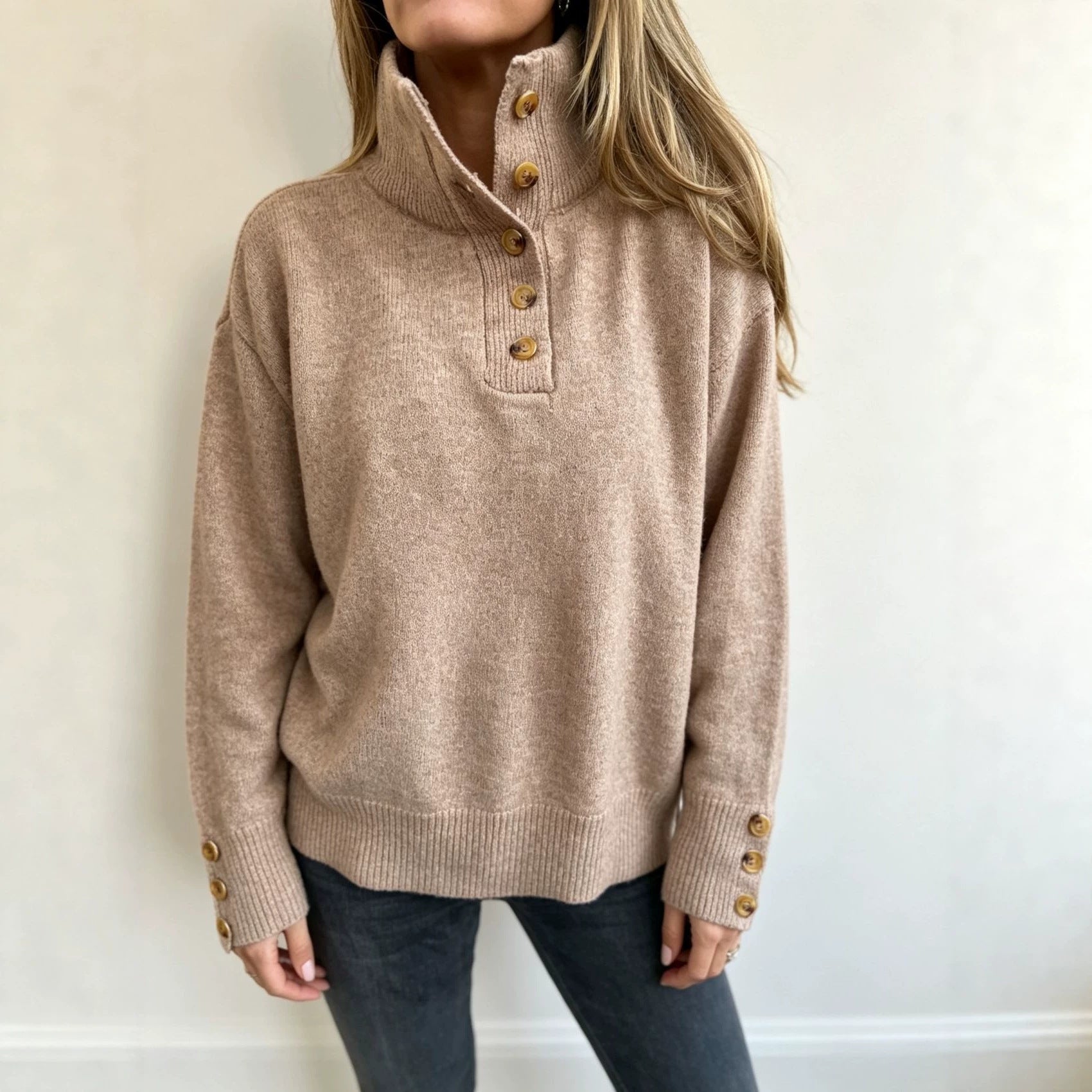 Taupe long-sleeve knit pullover with button placket, stand collar and ribbed cuffs