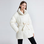 Women's tailored quilted puffer coat in off-white with tie belt and high shawl collar