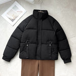 Black short quilted puffer jacket, high stand collar, full zip, D-ring strap pockets