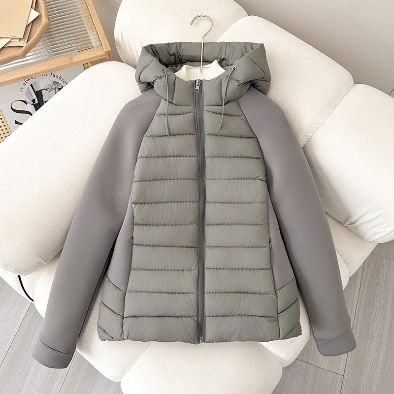 Women’s light hybrid quilted jacket with hood, gray, zip-up front on chair