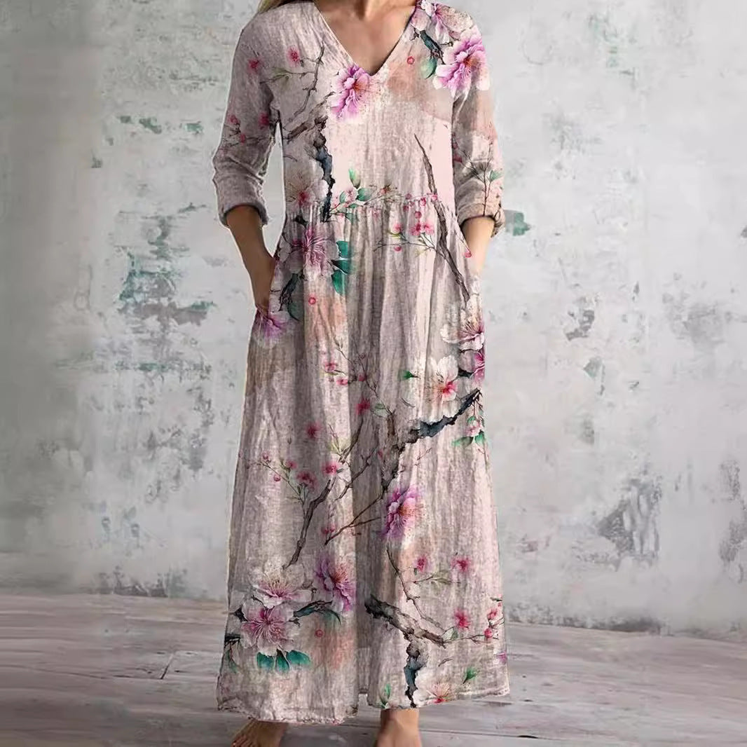 Floral long dress in light gray with V-neck and three-quarter sleeves, gathered waist