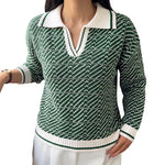 Green V-neck long-sleeve sweater with small geometric knit pattern and white ribbed trim.