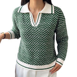 Green V-neck long-sleeve sweater with small geometric knit pattern and white ribbed trim.