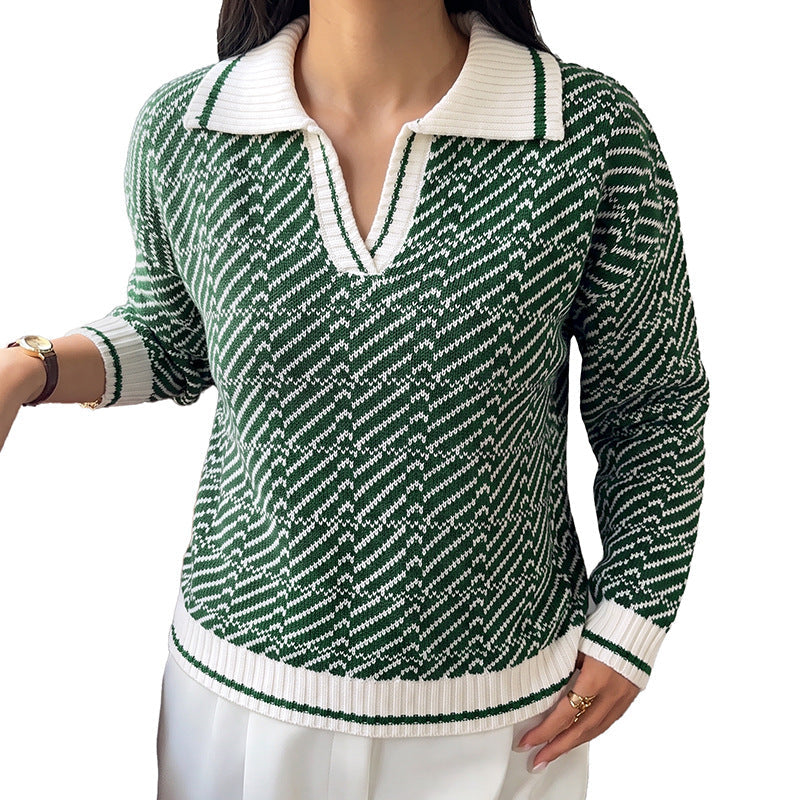 Green V-neck long-sleeve sweater with small geometric knit pattern and white ribbed trim.