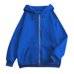 Blue oversized zip-up hoodie with hood, kangaroo pockets, and ribbed cuffs