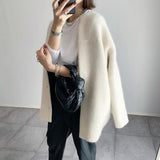 Cream button-front knit cardigan with long sleeves and open front