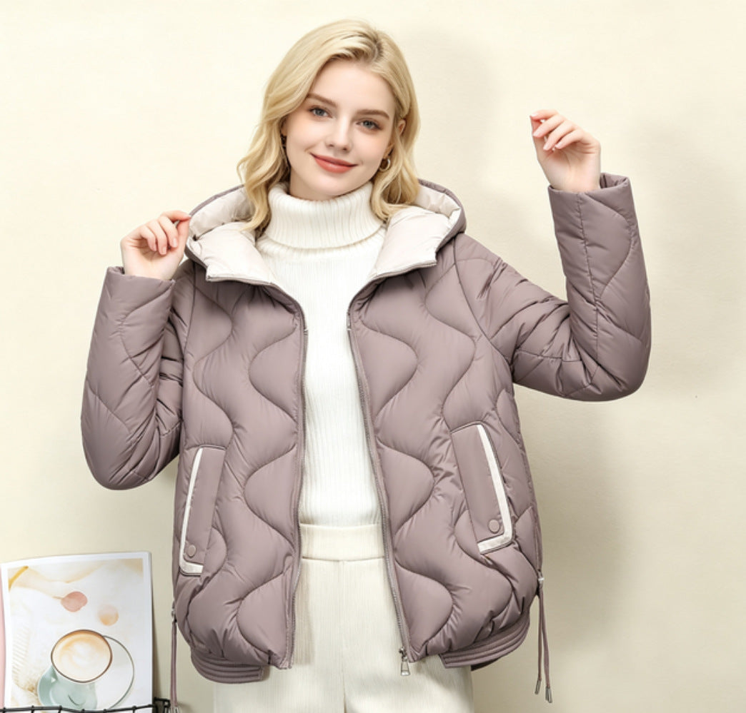 Light taupe quilted short jacket with hood, heart stitching, zip front and drawstring hem.