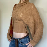 Khaki cropped knit turtleneck with cable pattern and visible front button placket