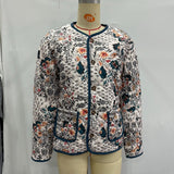 Women's patterned long-sleeve jacket with round neck, zip front, blue trim and front pockets