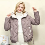 Light taupe quilted short jacket with hood, heart stitching, zip front and drawcord hem.