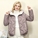 Light taupe quilted short jacket with hood, heart stitching, zip front and drawcord hem.