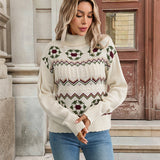 Cream knit turtleneck sweater with fair isle reindeer motif and ribbed cuff detailing
