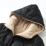 Black hooded jacket with beige sherpa hood lining and zip-front edge