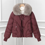 Burgundy short puffer pilot jacket with large faux fur collar and drawstring hem.