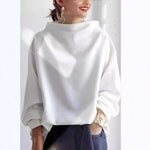 White high-neck soft knit top with loose fit and long sleeves