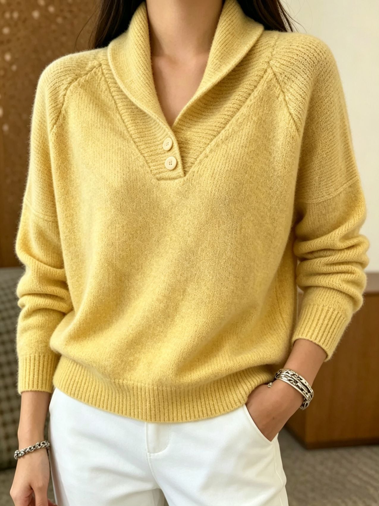 Women’s yellow button-front V-neck long-sleeve sweater with ribbed cuffs and hem.