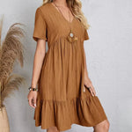Tan V-neck tiered midi dress with short sleeves, relaxed fit and tiers