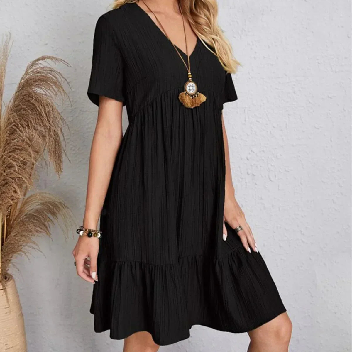 Black V-neck tiered midi dress with short sleeves, layered tiered hem