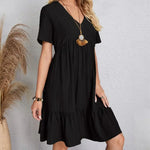 Black V-neck tiered midi dress with short sleeves, layered tiered hem
