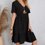Black V-neck tiered midi dress with short sleeves, layered tiered hem